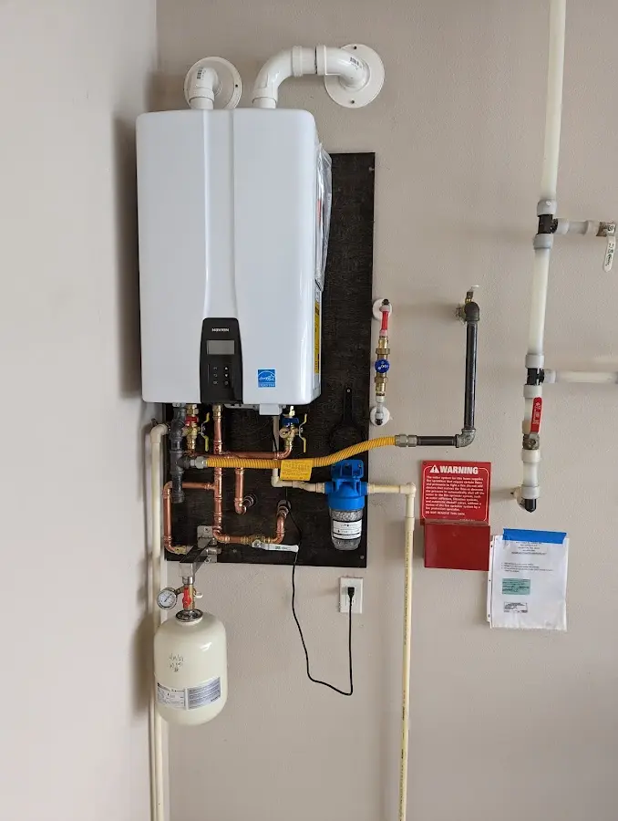 Professional plumber installing copper piping in a Skidaway Island home